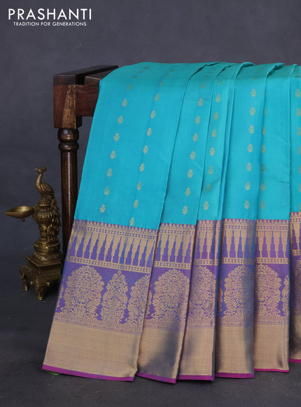 Pure kanchipuram silk saree teal blue shade and dual shade of pink with allover zari woven buttas and long zari woven border