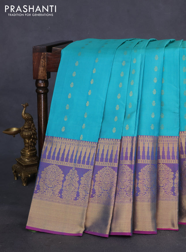 Pure kanchipuram silk saree teal blue shade and dual shade of pink with allover zari woven buttas and long zari woven border