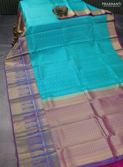 Pure kanchipuram silk saree teal blue shade and dual shade of pink with allover zari woven buttas and long zari woven border