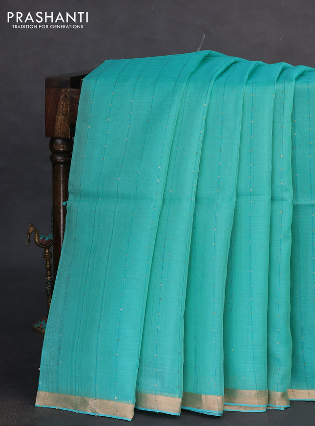 Pure organza silk saree teal green shade with allover sequin stripe pattern and jamdhani design pallu
