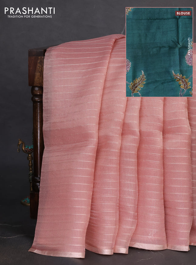 Pure organza silk saree peach pink shade and teal green shade with allover zari weaves and zari woven piping border & kalamkari pita work blouse