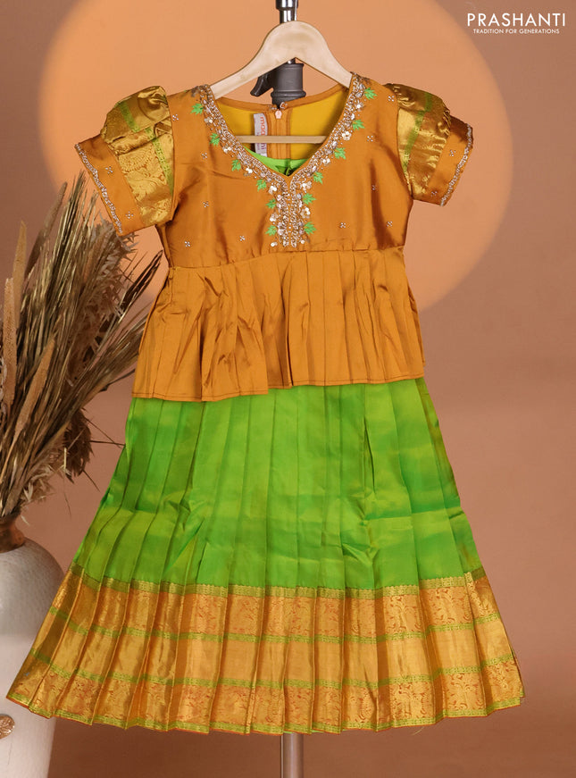 Silk kids lehenga mustard yellow and green with aari work neck pattern & puff sleeve and zari woven border