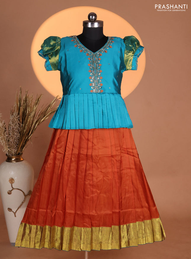 Silk kids lehenga teal shade and rust shade with aari work neck pattern & puff sleeve and zari woven border