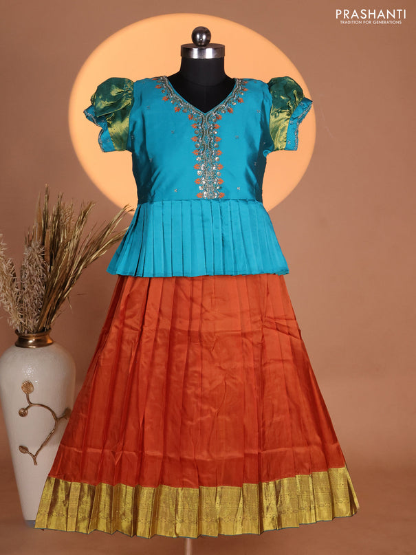 Silk kids lehenga teal shade and rust shade with aari work neck pattern & puff sleeve and zari woven border