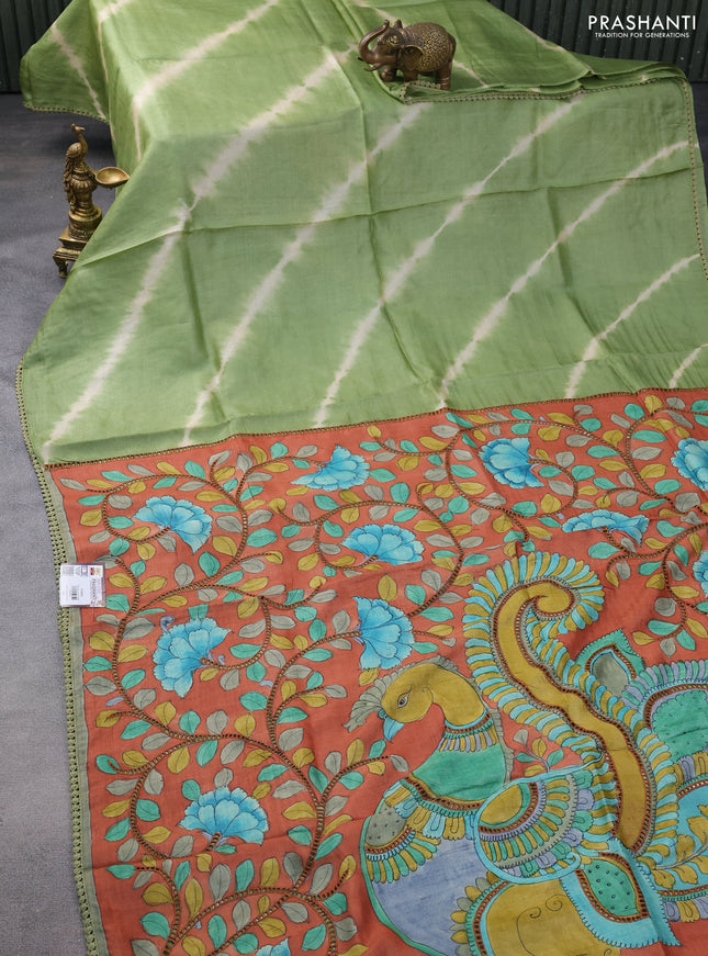 Pure tussar silk saree pastel green and rust shade with allover tie & dye prints and kalamkari prints & cut work pallu