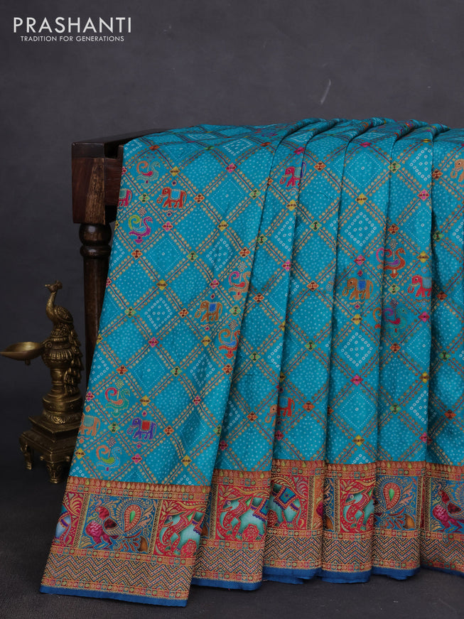 Banarasi silk saree teal blue and peacock blue with allover position prints and printed border