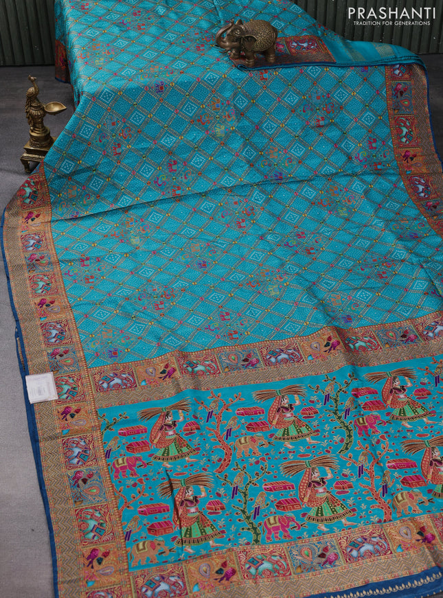 Banarasi silk saree teal blue and peacock blue with allover position prints and printed border
