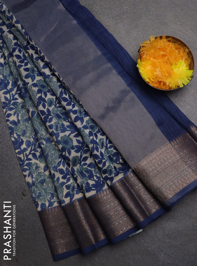 Chanderi silk cotton saree off white and peacock blue with allover floral prints and banarsi style border