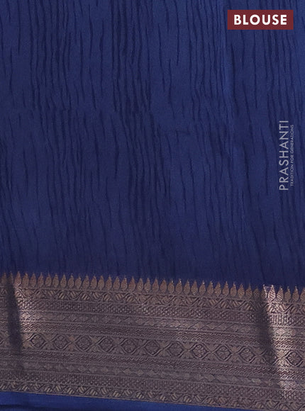 Chanderi silk cotton saree off white and peacock blue with allover floral prints and banarsi style border