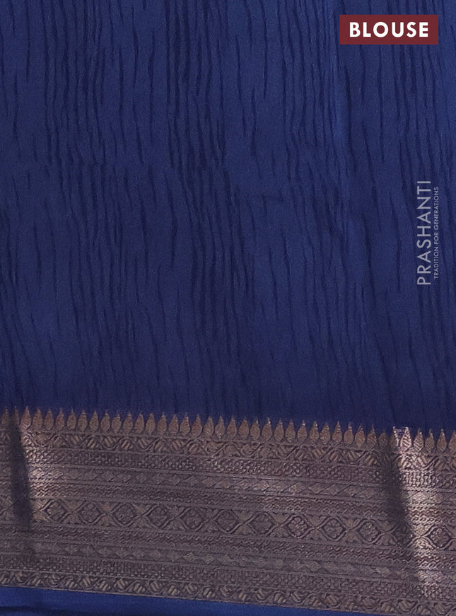 Chanderi silk cotton saree off white and peacock blue with allover floral prints and banarsi style border