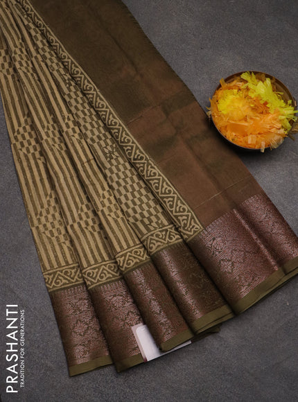 Chanderi silk cotton saree beige and mehendi green with allover prints and banarasi style border