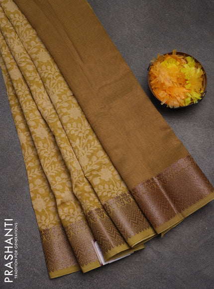 Chanderi silk cotton saree mustard shade with allover floral prints and banarasi style border