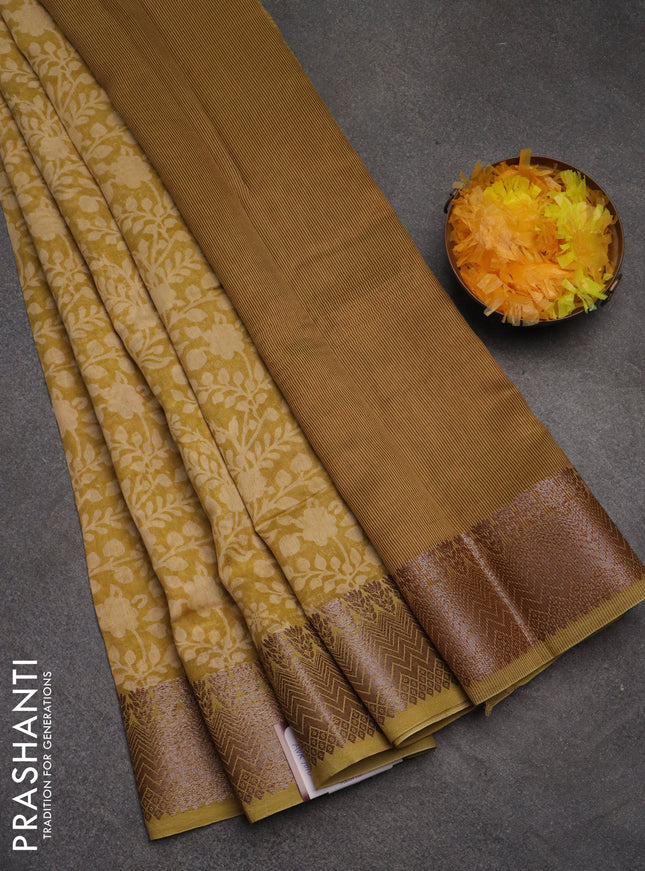 Chanderi silk cotton saree mustard shade with allover floral prints and banarasi style border