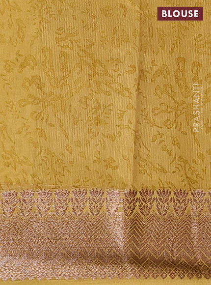 Chanderi silk cotton saree mustard shade with allover floral prints and banarasi style border