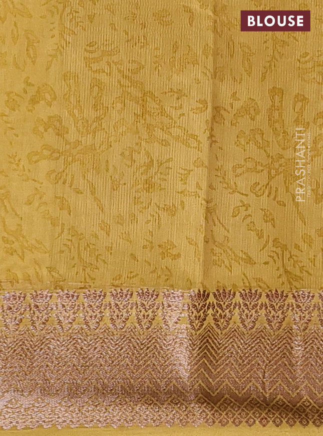 Chanderi silk cotton saree mustard shade with allover floral prints and banarasi style border