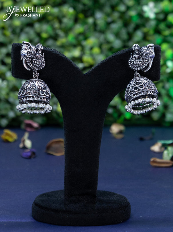 Oxidised jhumka lakshmi design with black stones and pearl hangings