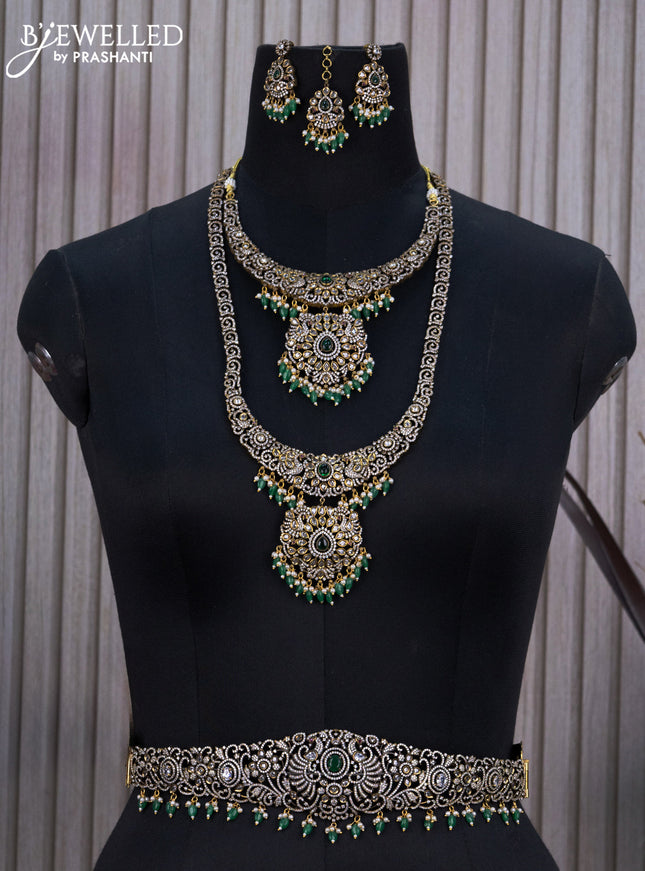 Bridal set with emerald & cz stones and beads hangings in victorian finish
