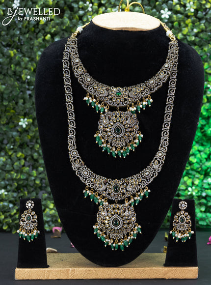 Bridal set with emerald & cz stones and beads hangings in victorian finish