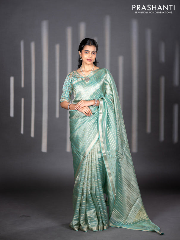 Tissue silk saree teal shade with allover silver & zari weaves and zari woven border