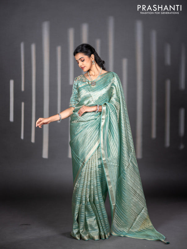 Tissue silk saree teal shade with allover silver & zari weaves and zari woven border