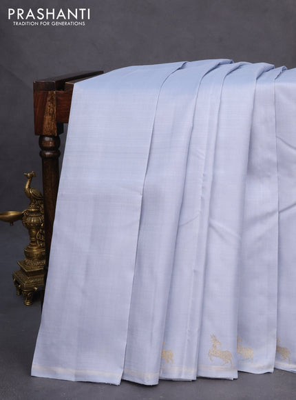 Pure kanchipuram silk saree bluish grey with plain body and zari woven butta border
