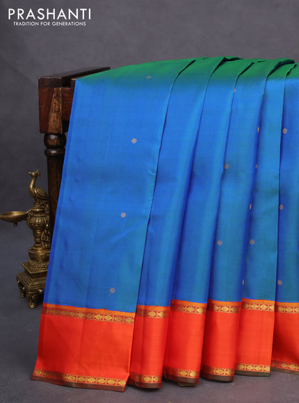 Pure kanchipuram silk saree dual shade of cs blue and orange with zari woven buttas and rettapet zari woven border