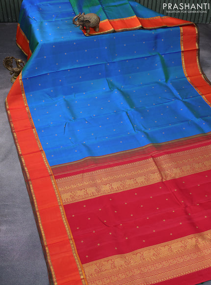 Pure kanchipuram silk saree dual shade of cs blue and orange with zari woven buttas and rettapet zari woven border