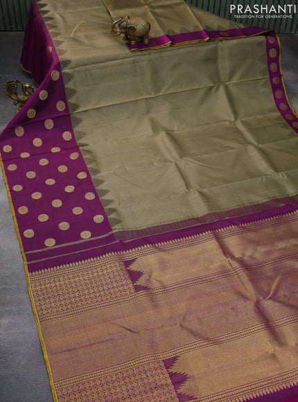 Pure kanchipuram silk saree military green and purple with allover zari woven brocade weaves and long zari woven butta border