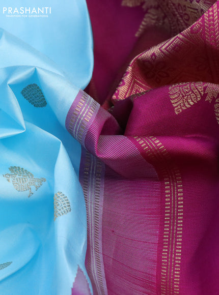 Pure kanchipuram silk saree light blue and purple with zari woven buttas and long zari woven checked butta border
