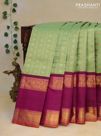 Pure kanchipuram silk saree pastel green and purple with allover zari checks & buttas and long rettapet zari woven korvai border