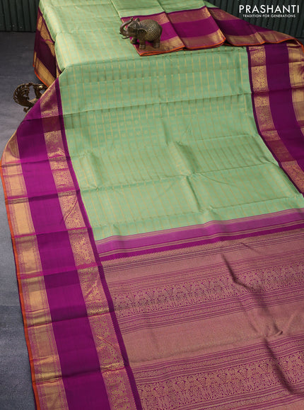 Pure kanchipuram silk saree pastel green and purple with allover zari checks & buttas and long rettapet zari woven korvai border
