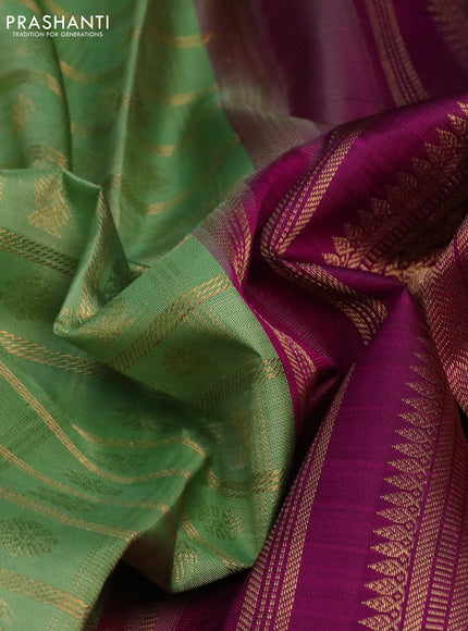 Pure kanchipuram silk saree pastel green and purple with allover zari checks & buttas and long rettapet zari woven korvai border