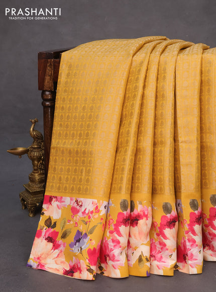 Banarasi silk saree mustard yellow with allover zari woven brocade weaves and floral digital printed border