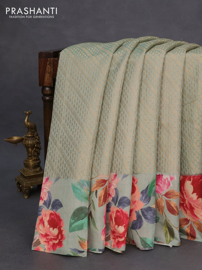 Banarasi silk saree pastel green with allover zari woven brocade weaves and floral digital printed border