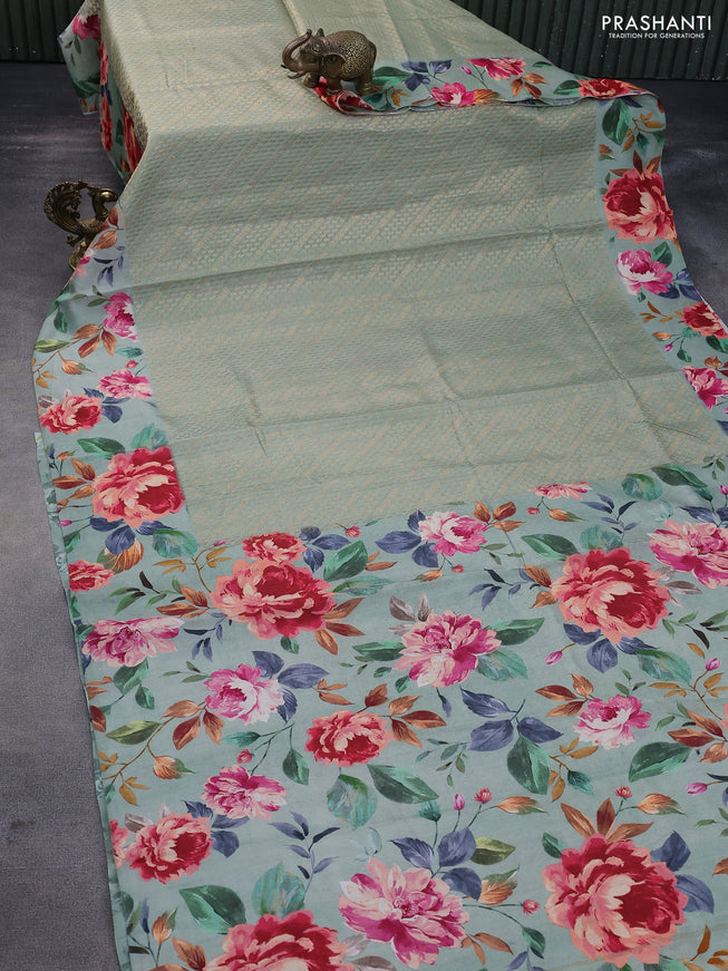 Banarasi silk saree pastel green with allover zari woven brocade weaves and floral digital printed border