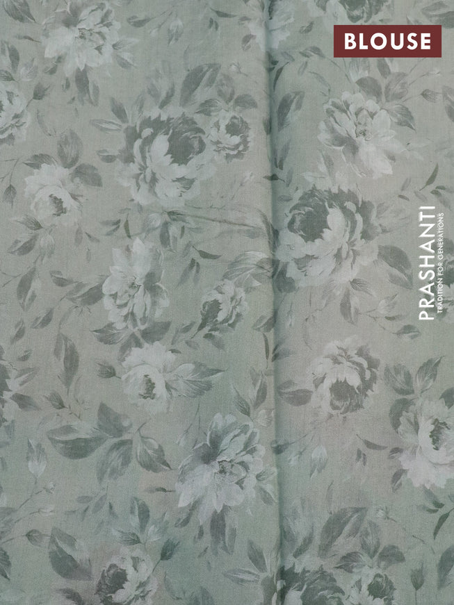 Banarasi silk saree pastel green with allover zari woven brocade weaves and floral digital printed border