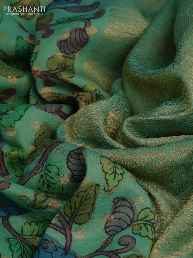 Pure kanchipuram silk saree pastel green and pink with allover pen kalamkari prints & zari buttas and zari woven border