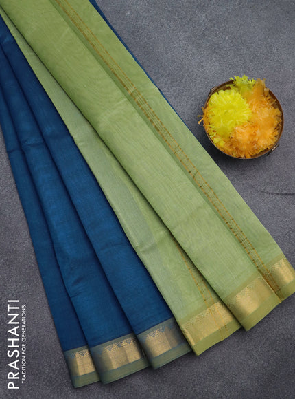 Silk cotton saree peacock blue and pastel green shade with plain body and zari woven border