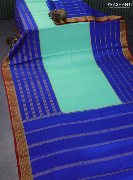 Pure mysore silk saree teal green shade and blue maroon with plain body and long zari woven border