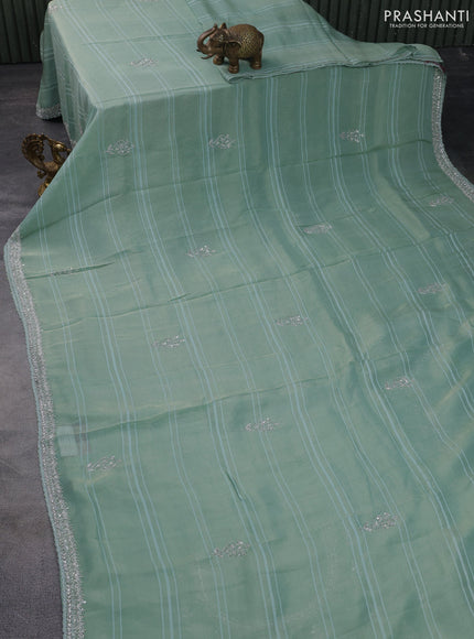 Tissue silk saree teal blue with embroidery work buttas and sequin & beaded work border