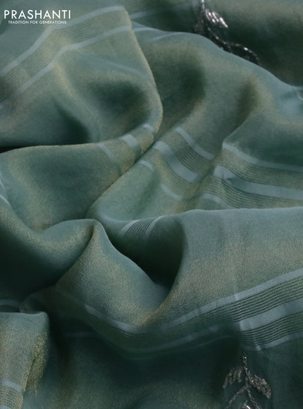 Tissue silk saree teal blue with embroidery work buttas and sequin & beaded work border