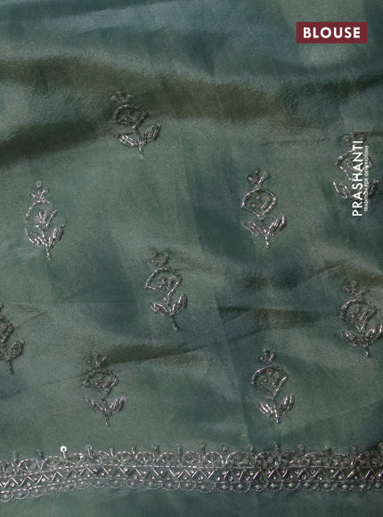 Tissue silk saree teal blue with embroidery work buttas and sequin & beaded work border