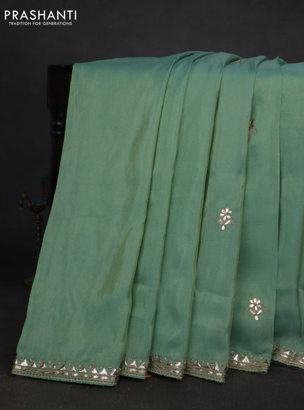 Tissue silk saree teal blue with gotapatti work buttas and gottapatti lace work border