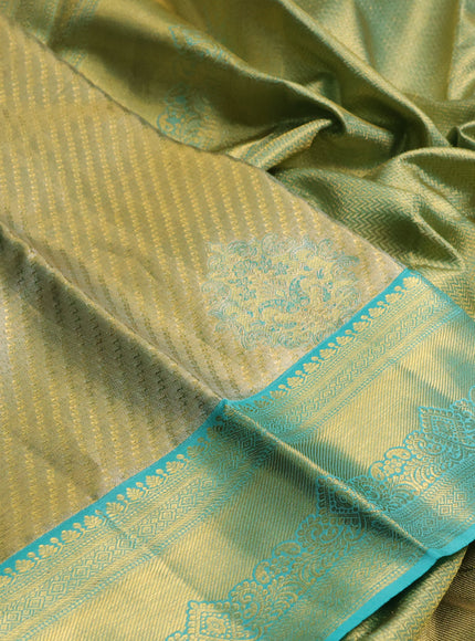 Pure kanchipuram tissue silk saree gold and teal blue with allover zari woven brocade weaves and rich zari woven border
