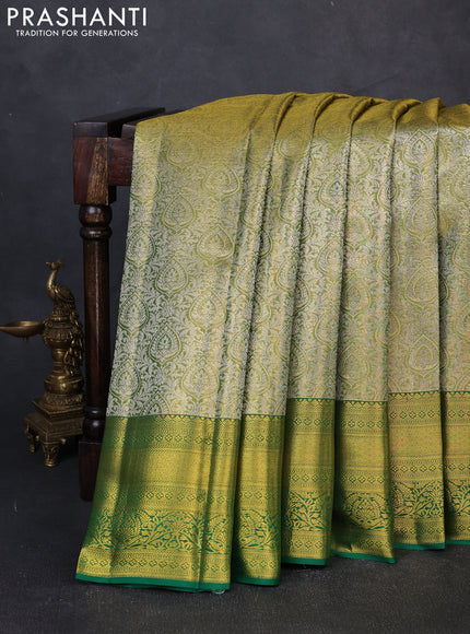 Pure kanchipuram tissue silk saree light green and green with allover zari woven brocade weaves and rich zari woven border