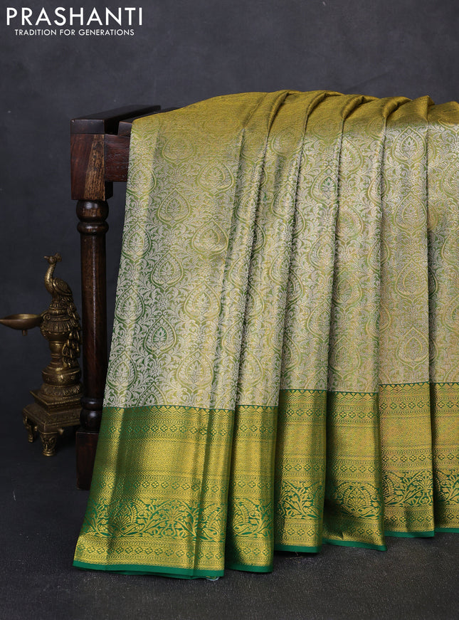 Pure kanchipuram tissue silk saree light green and green with allover zari woven brocade weaves and rich zari woven border
