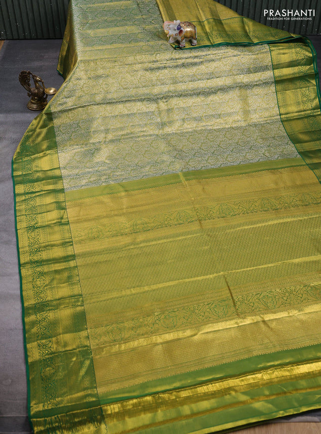 Pure kanchipuram tissue silk saree light green and green with allover zari woven brocade weaves and rich zari woven border