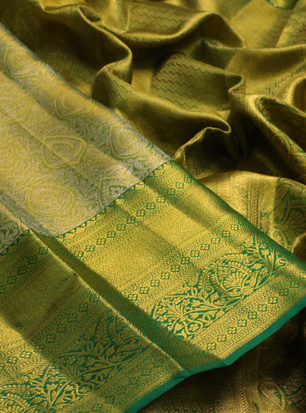 Pure kanchipuram tissue silk saree light green and green with allover zari woven brocade weaves and rich zari woven border