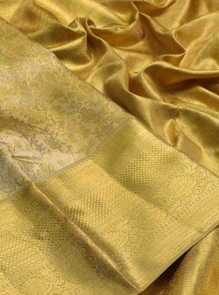 Pure kanchipuram tissue silk saree gold with allover zari woven floral brocade weaves and rich zari woven border