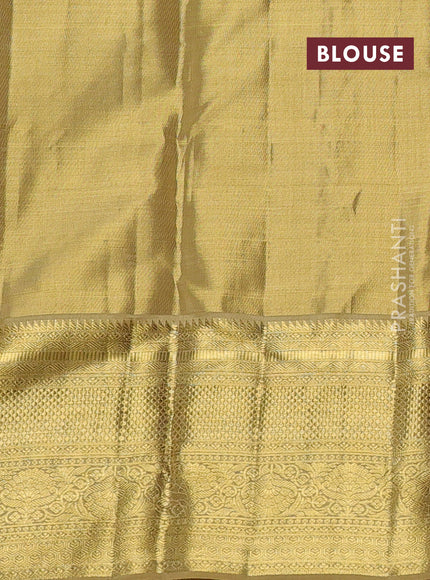 Pure kanchipuram tissue silk saree gold with allover zari woven floral brocade weaves and rich zari woven border